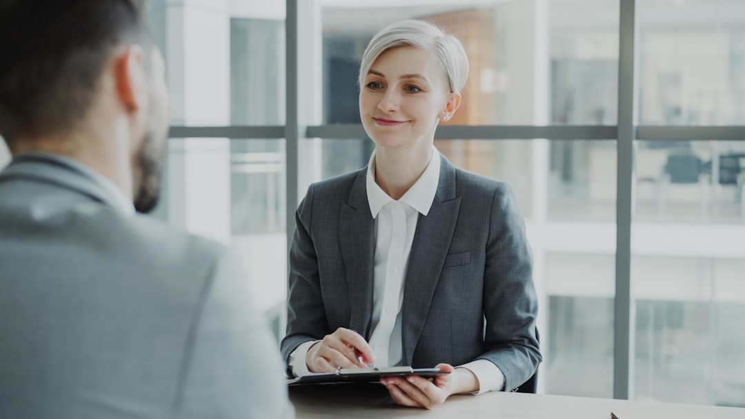 Recruiter interviewing a candidate in a modern office